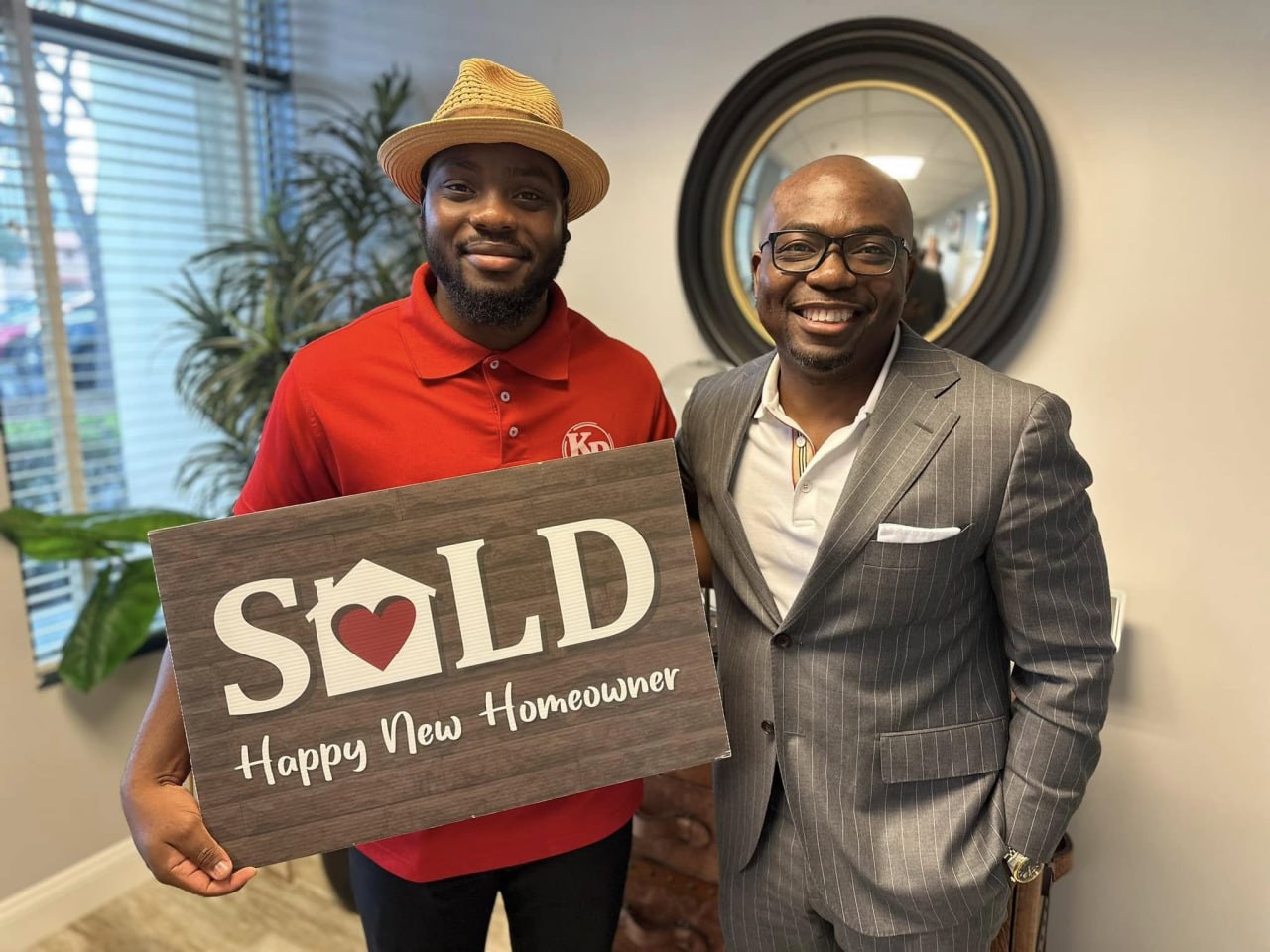 Wade Darius celebrating a closing with a happy new homeowner